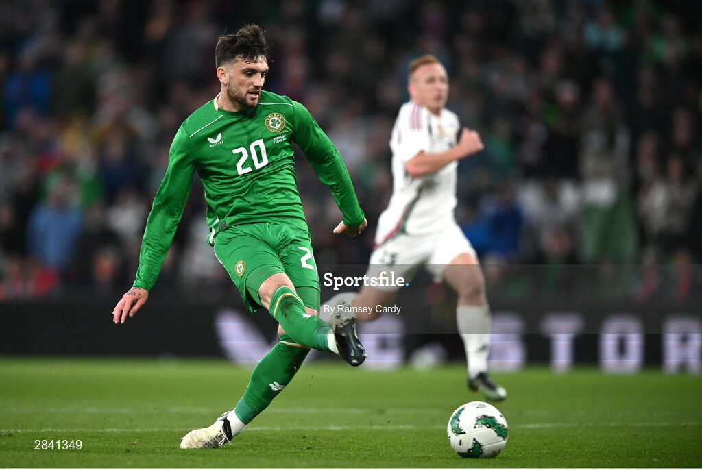4 June 2024; Troy Parrott of Republic of Ireland shoots to score his side's second goal during the international friendly match between Republic of Ireland and Hungary at Aviva Stadium in Dublin. Photo by Ramsey Cardy/Sportsfile