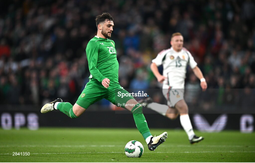 4 June 2024; Troy Parrott of Republic of Ireland shoots to score his side's second goal during the international friendly match between Republic of Ireland and Hungary at Aviva Stadium in Dublin. Photo by Ramsey Cardy/Sportsfile