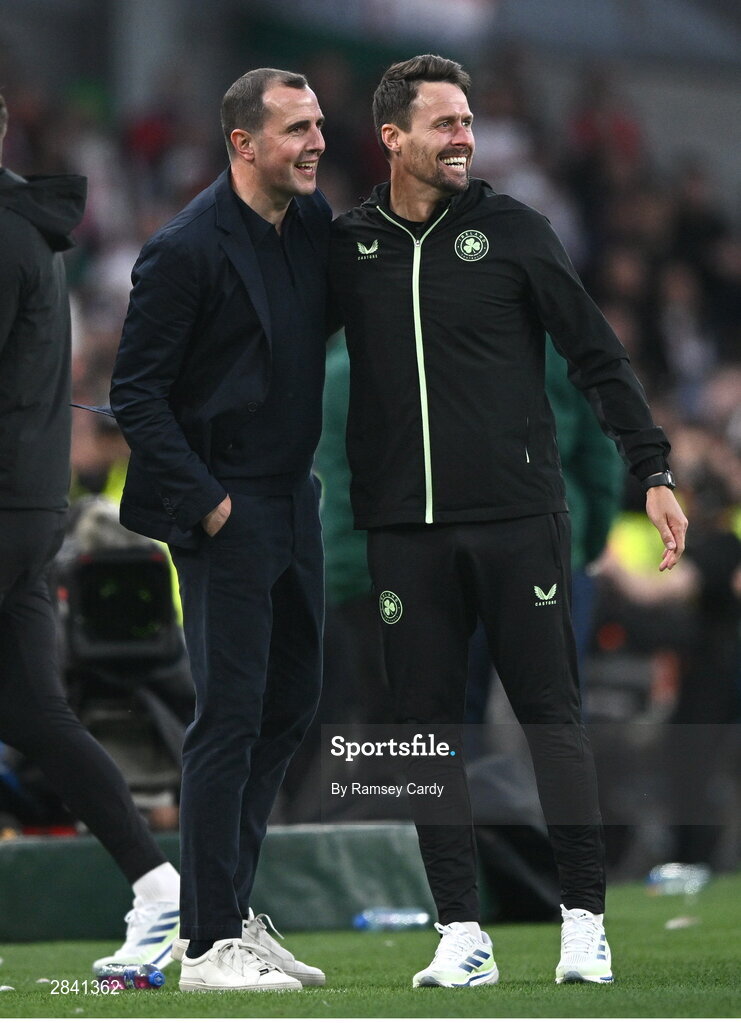 4 June 2024; Republic of Ireland interim head coach John O'Shea celebrates with assistant coach Paddy McCarthy after his side's second goal during the international friendly match between Republic of Ireland and Hungary at Aviva Stadium in Dublin. Photo by Ramsey Cardy/Sportsfile