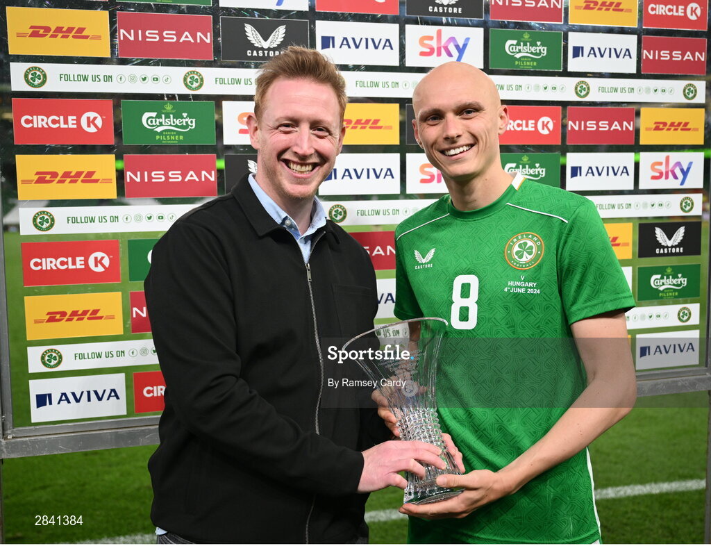 4 June 2024; Will Smallbone of Republic of Ireland is presented with the player of the match award by Sky Ireland head of communications Neal Cummins after the international friendly match between Republic of Ireland and Hungary at Aviva Stadium in Dublin. Photo by Ramsey Cardy/Sportsfile