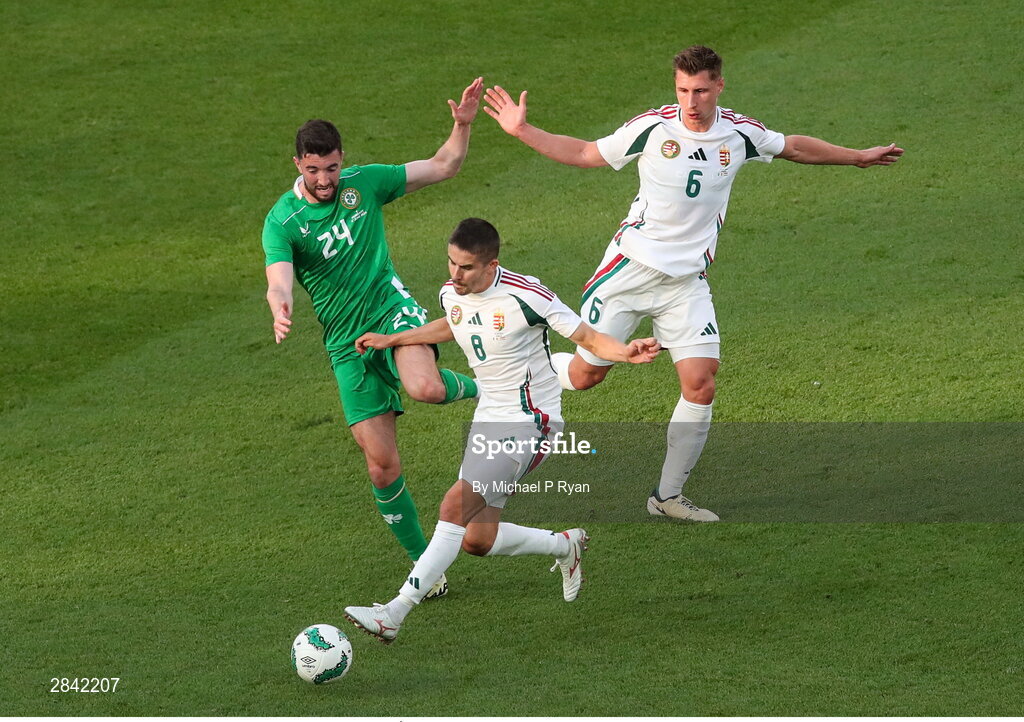 4 June 2024; Finn Azaz of Republic of Ireland in action against Ádám Nagy, and Willi Orbán of Hungary during the international friendly match between Republic of Ireland and Hungary at Aviva Stadium in Dublin. Photo by Michael P Ryan/Sportsfile