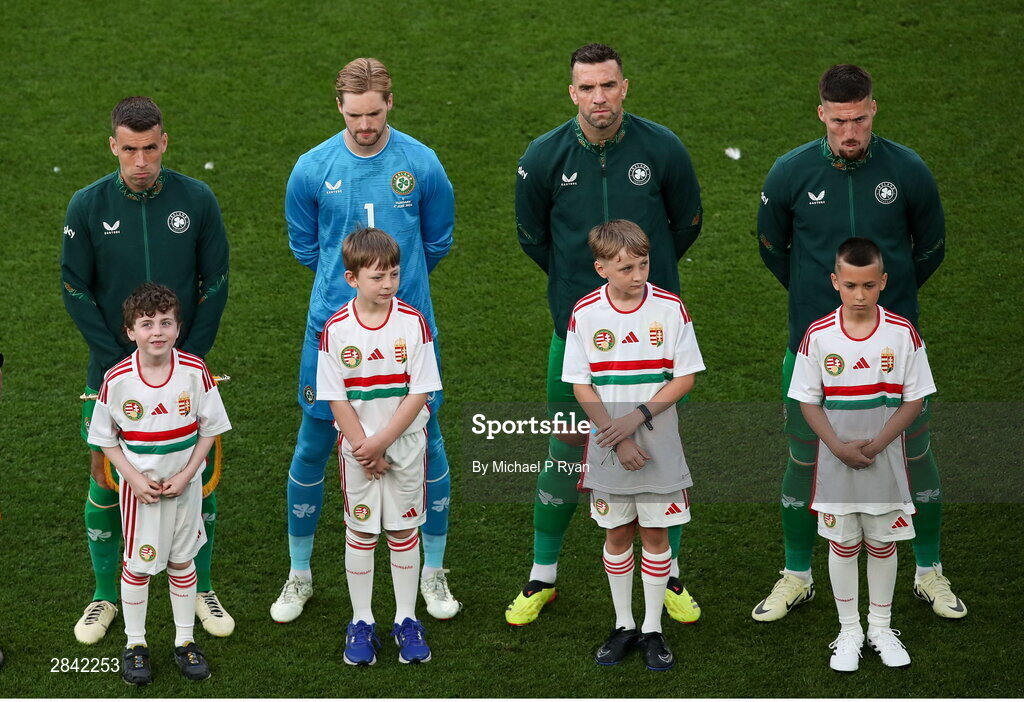 4 June 2024; Republic of Ireland players, from left, Seamus Coleman, Caoimhin Kelleher, Shane Duffy and Matt Doherty with mascots before the international friendly match between Republic of Ireland and Hungary at Aviva Stadium in Dublin. Photo by Michael P Ryan/Sportsfile