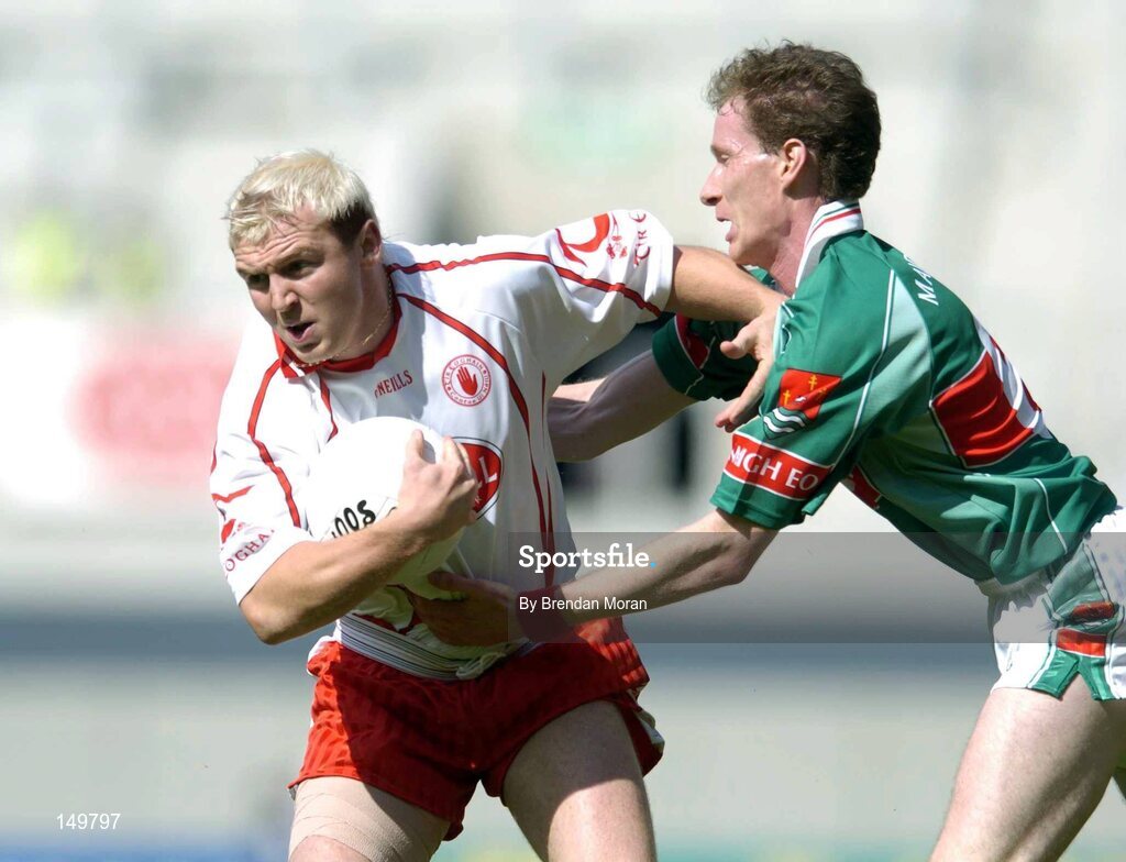 7 August 2004; Eoin Mulligan, Tyrone, in action against James Nallen, Mayo. Bank of Ireland All-Ireland Senior Football Championship Quarter Final, Mayo v Tyrone, Croke Park, Dublin. Picture credit; Brendan Moran / SPORTSFILE