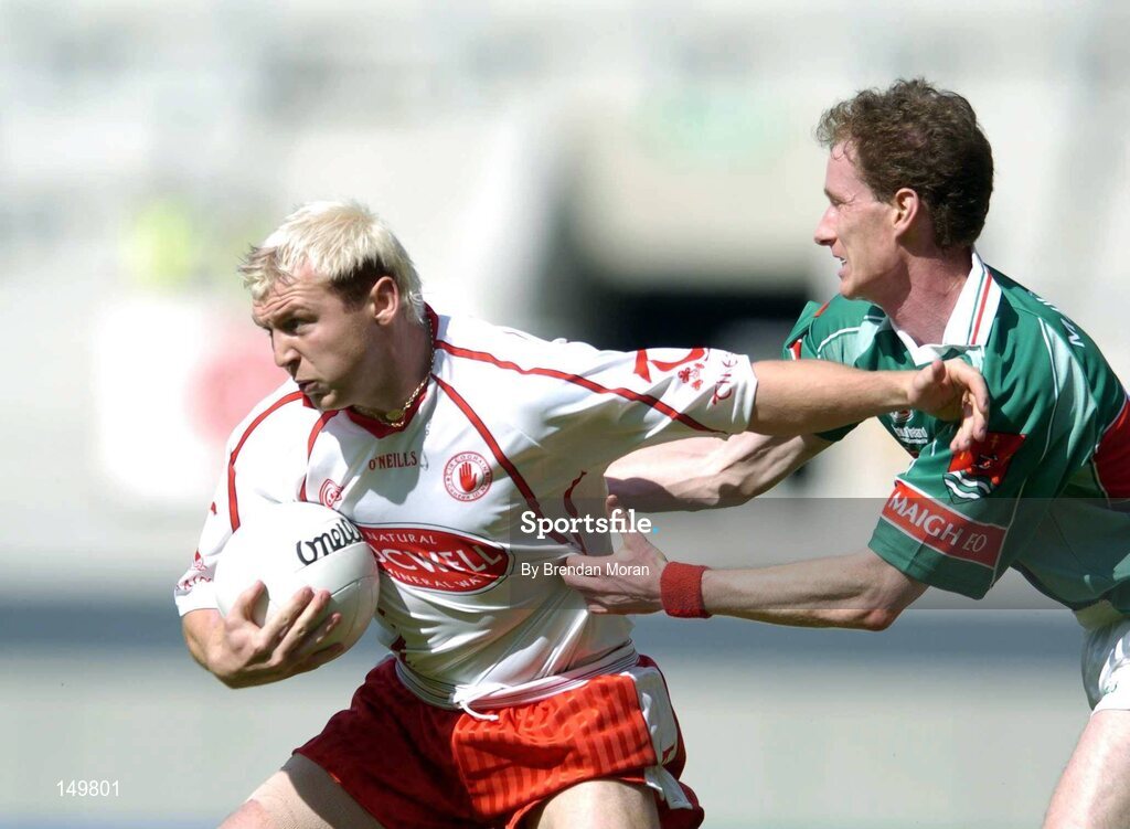 7 August 2004; Eoin Mulligan, Tyrone, in action against James Nallen, Mayo. Bank of Ireland All-Ireland Senior Football Championship Quarter Final, Mayo v Tyrone, Croke Park, Dublin. Picture credit; Brendan Moran / SPORTSFILE