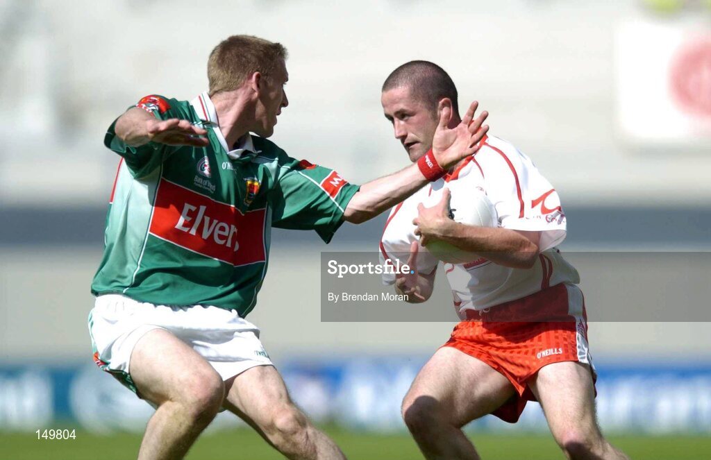 7 August 2004; Stephen O'Neill, Tyrone, in action against David Heaney, Mayo. Bank of Ireland All-Ireland Senior Football Championship Quarter Final, Mayo v Tyrone, Croke Park, Dublin. Picture credit; Brendan Moran / SPORTSFILE