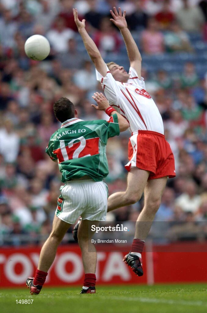 7 August 2004; Kevin Hughes, Tyrone, in action against Alan Dillon, Mayo. Bank of Ireland All-Ireland Senior Football Championship Quarter Final, Mayo v Tyrone, Croke Park, Dublin. Picture credit; Brendan Moran / SPORTSFILE