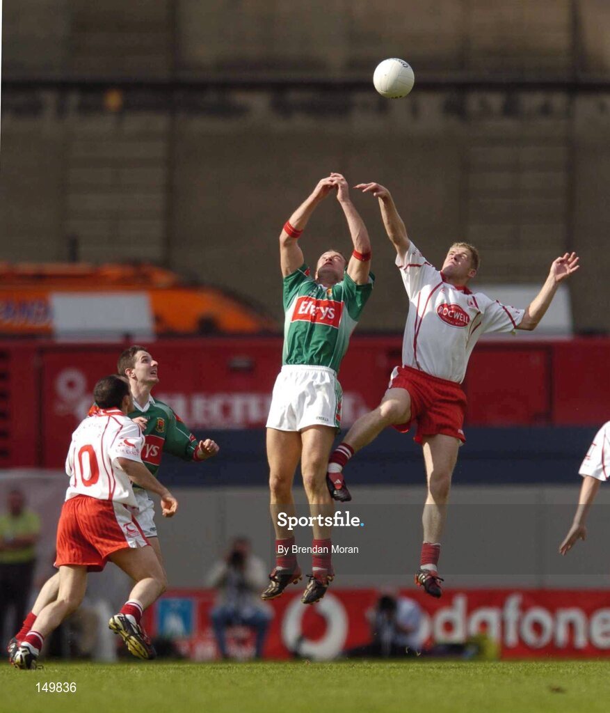7 August 2004; David Brady, Mayo, contests a high ball with Kevin Hughes, Tyrone. Bank of Ireland All-Ireland Senior Football Championship Quarter Final, Mayo v Tyrone, Croke Park, Dublin. Picture credit; Brendan Moran / SPORTSFILE