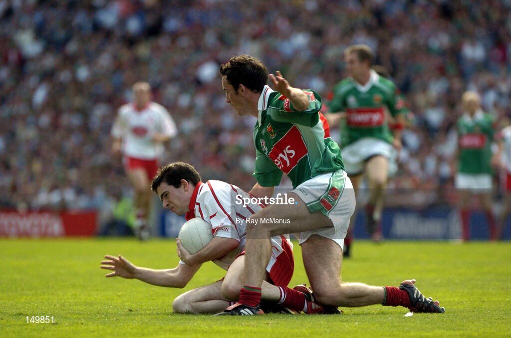 7 August 2004; Mark Harte, Tyrone, is tackled by Conor Moran, Mayo. Bank of Ireland All-Ireland Senior Football Championship Quarter Final, Mayo v Tyrone, Croke Park, Dublin. Picture credit; Ray McManus / SPORTSFILE