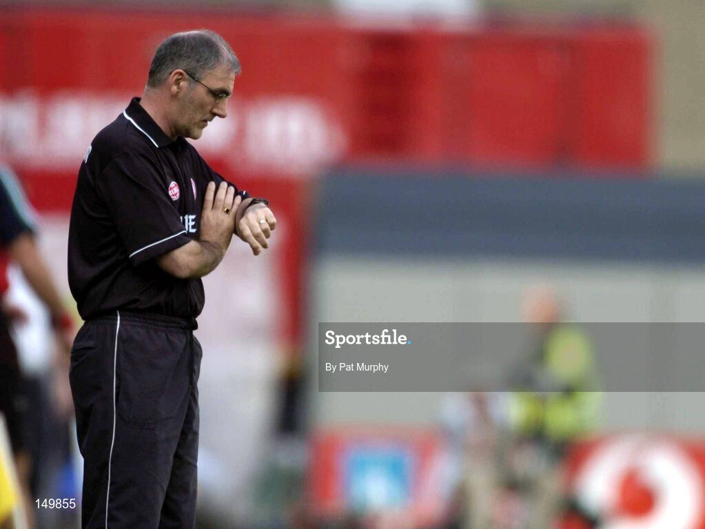 7 August 2004; Mickey Harte, Tyrone manager, checks his watch in the final moments of the game. Bank of Ireland All-Ireland Senior Football Championship Quarter Final, Mayo v Tyrone, Croke Park, Dublin. Picture credit; Pat Murphy / SPORTSFILE