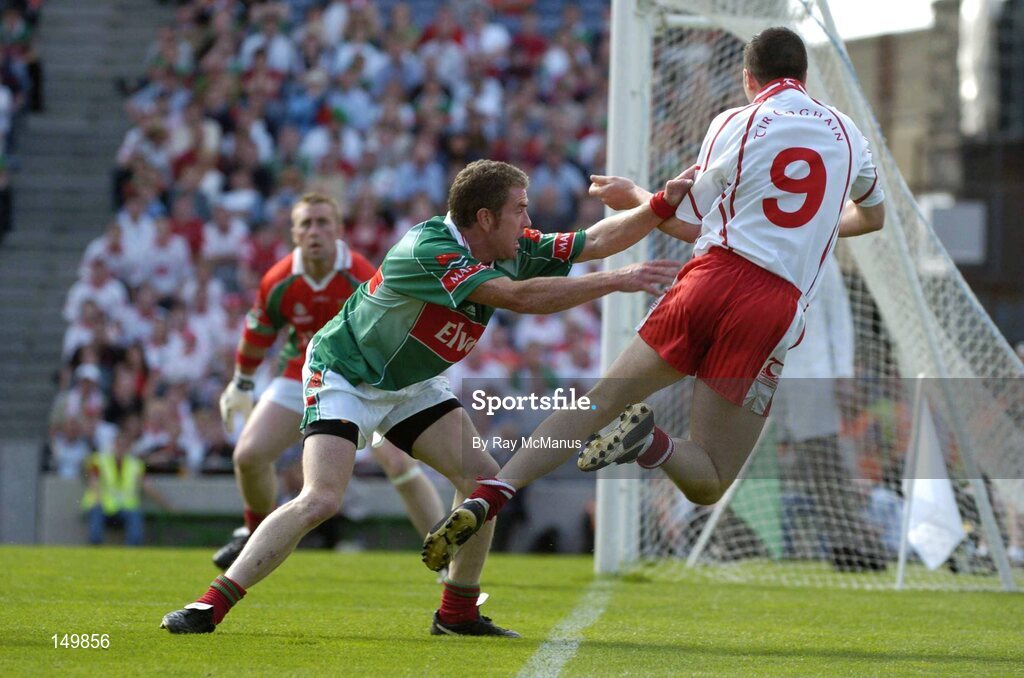 7 August 2004; Sean Cavanagh, Tyrone, falls over the end line under pressure from Gary Ruane, Mayo. Bank of Ireland All-Ireland Senior Football Championship Quarter Final, Mayo v Tyrone, Croke Park, Dublin. Picture credit; Ray McManus / SPORTSFILE