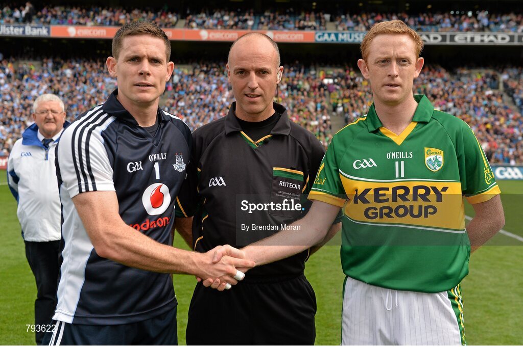 1 September 2013; Team captains Stephen Cluxton, Dublin, and Colm Cooper, Kerry, shake hands, in the company of referee Cormac Reilly, before the game. GAA Football All-Ireland Senior Championship, Semi-Final, Dublin v Kerry, Croke Park, Dublin. Picture credit: Brendan Moran / SPORTSFILE