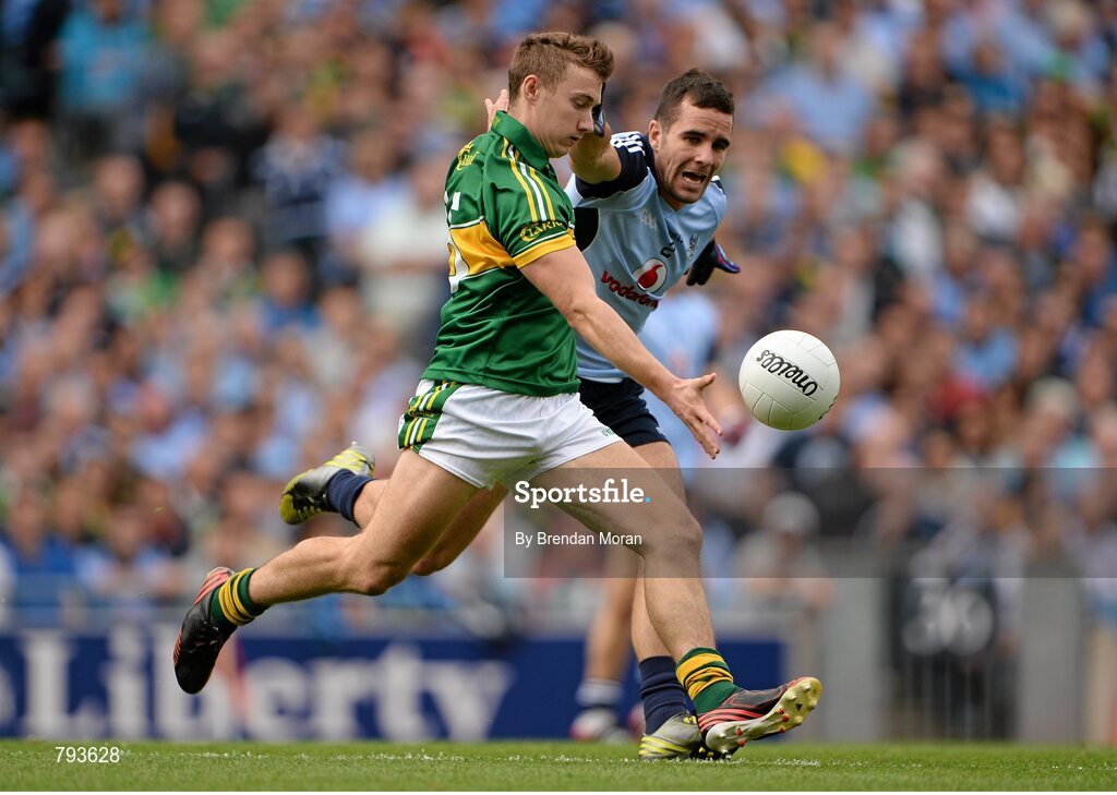 1 September 2013; James O'Donoghue, Kerry, kicks a point despite the best efforts of Kevin O'Brien, Dublin. GAA Football All-Ireland Senior Championship, Semi-Final, Dublin v Kerry, Croke Park, Dublin. Picture credit: Brendan Moran / SPORTSFILE
