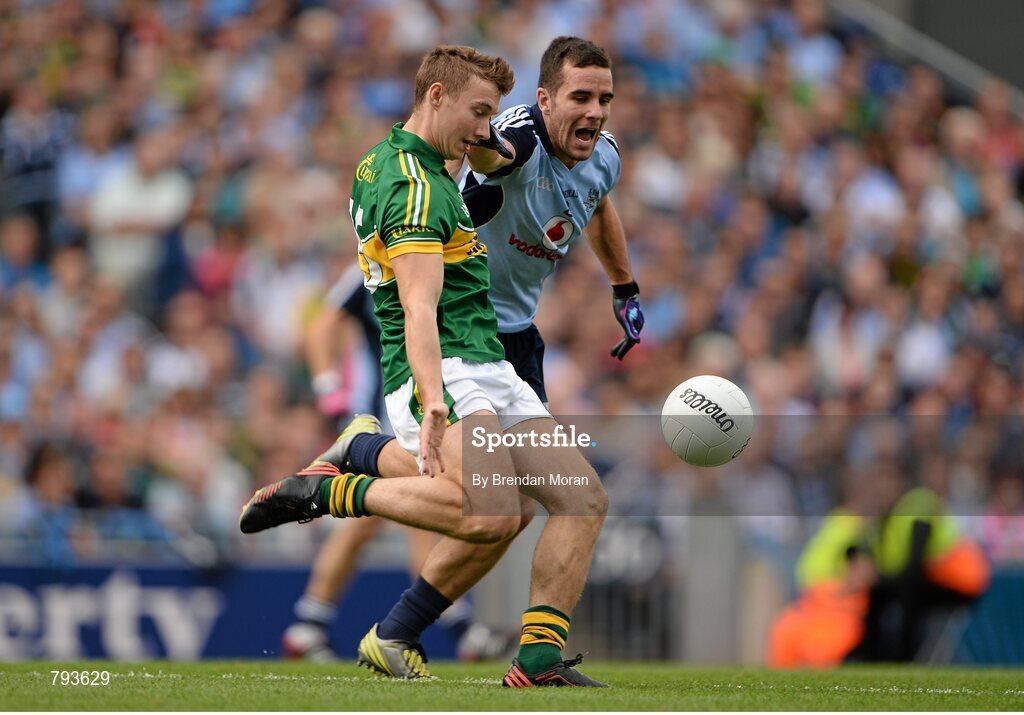 1 September 2013; James O'Donoghue, Kerry, kicks a point despite the best efforts of Kevin O'Brien, Dublin. GAA Football All-Ireland Senior Championship, Semi-Final, Dublin v Kerry, Croke Park, Dublin. Picture credit: Brendan Moran / SPORTSFILE