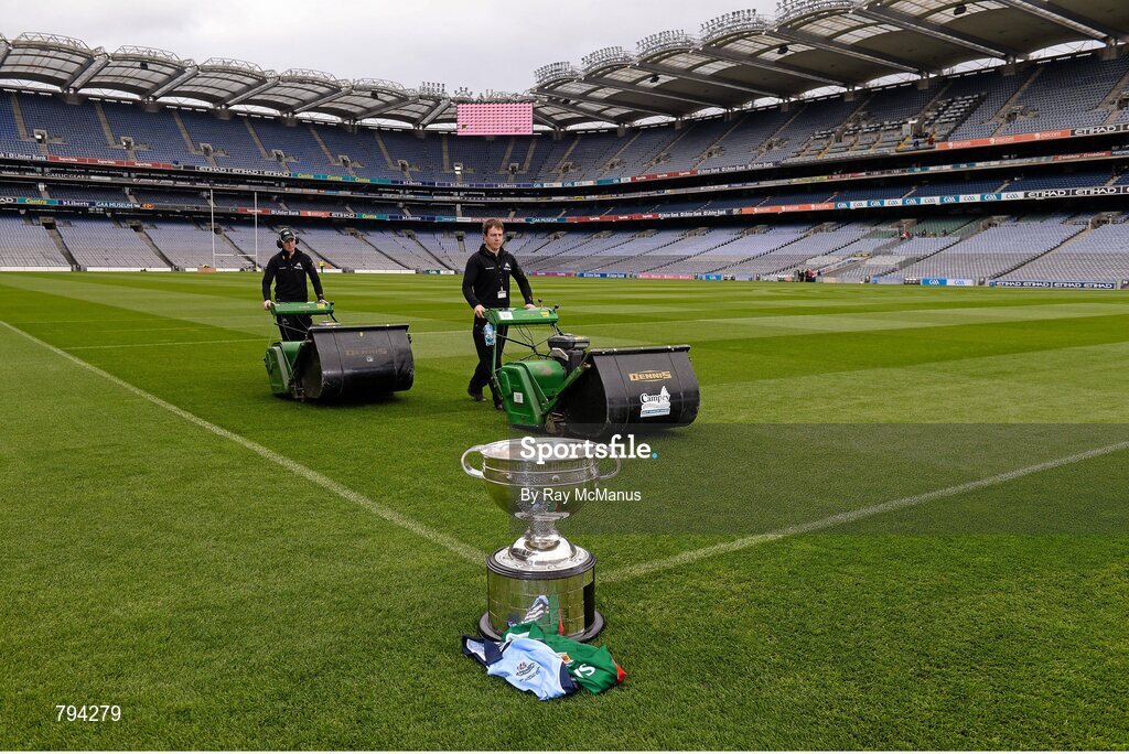 20 September 2013; The Sam Maguire cup sits proud as Croke Park pitch manager Stuart Wilson, right, and groundsman Padhraic Greene cut the pitch ahead of the GAA Football All-Ireland Senior Championship Final between Dublin and Mayo on Sunday. Croke Park, Dublin. Picture credit: Ray McManus / SPORTSFILE