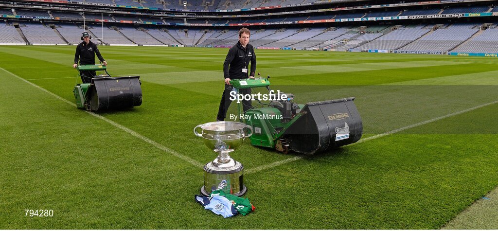 20 September 2013; The Sam Maguire cup sits proud as Croke Park pitch manager Stuart Wilson, right, and groundsman Padhraic Greene cut the pitch ahead of the GAA Football All-Ireland Senior Championship Final between Dublin and Mayo on Sunday. Croke Park, Dublin. Picture credit: Ray McManus / SPORTSFILE