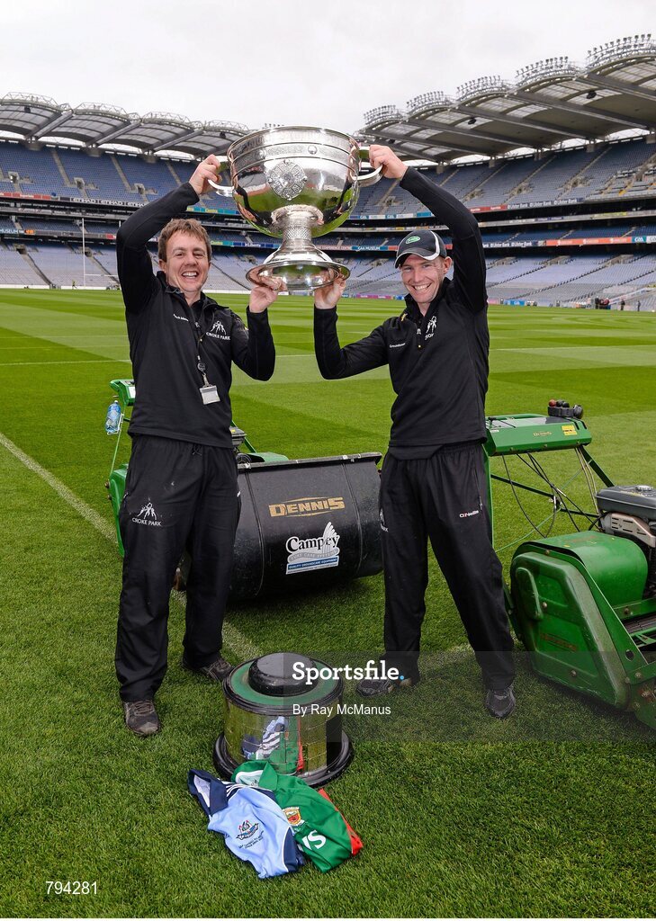 20 September 2013; Croke Park pitch manager Stuart Wilson, left, and groundsman Padhraic Greene jostle for possession of the Sam Maguire cup after cutting the pitch ahead of the GAA Football All-Ireland Senior Championship Final between Dublin and Mayo on Sunday. Croke Park, Dublin. Picture credit: Ray McManus / SPORTSFILE