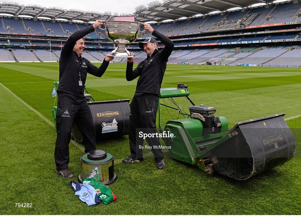 20 September 2013; Croke Park pitch manager Stuart Wilson, left, and groundsman Padhraic Greene jostle for possession of the Sam Maguire cup after cutting the pitch ahead of the GAA Football All-Ireland Senior Championship Final between Dublin and Mayo on Sunday. Croke Park, Dublin. Picture credit: Ray McManus / SPORTSFILE