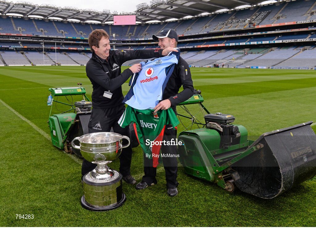 20 September 2013; Croke Park pitch manager Stuart Wilson, left, and groundsman Padhraic Greene with Dublin and Mayo jerseys and the Sam Maguire cup after cutting the pitch ahead of the GAA Football All-Ireland Senior Championship Final between Dublin and Mayo on Sunday. Croke Park, Dublin. Picture credit: Ray McManus / SPORTSFILE