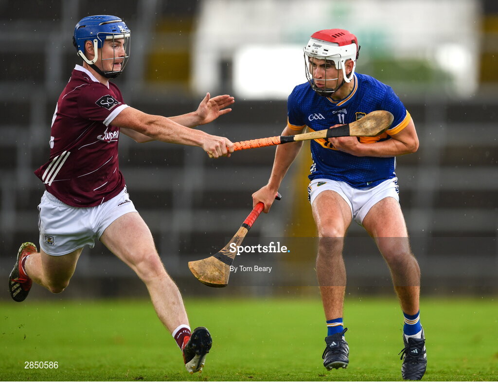 15 June 2024; Euan Murray of Tipperary is tackled by Cathal Maloney of Galway during the Electric Ireland GAA Hurling All-Ireland Minor Hurling Championship semi-final match between Tipperary and Galway at TUS Gaelic Grounds in Limerick. Photo by Tom Beary/Sportsfile