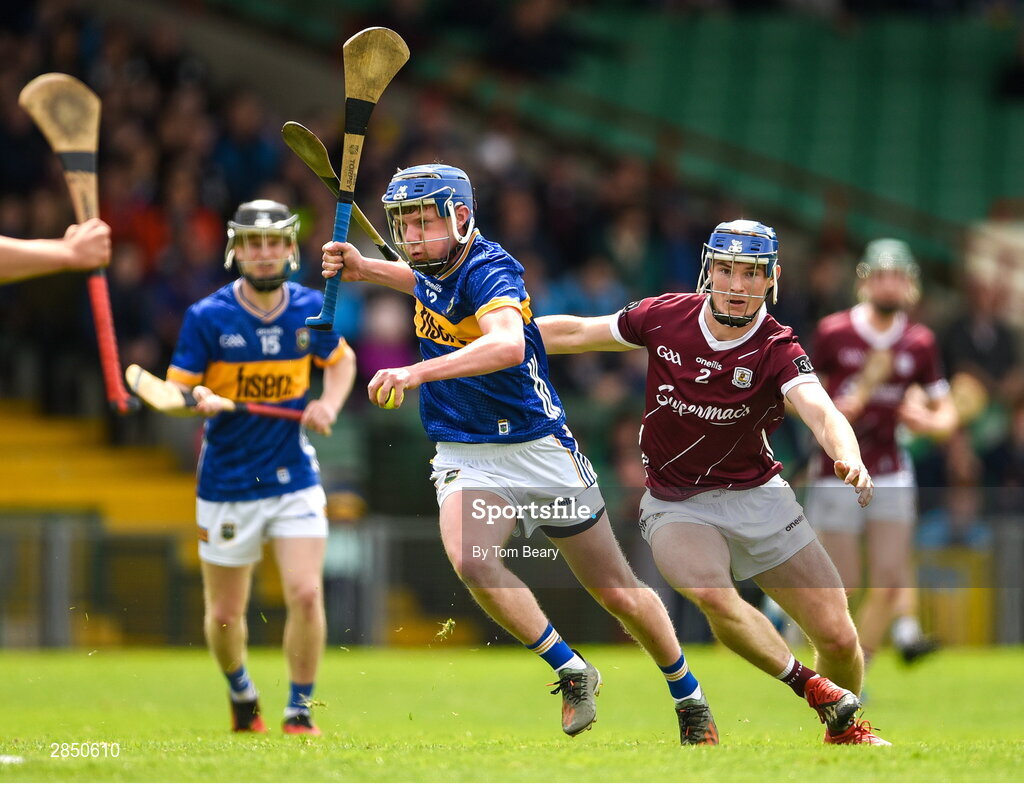 15 June 2024; Billy O'Brien of Tipperary is tackled by Cathal Maloney of Galway during the Electric Ireland GAA Hurling All-Ireland Minor Hurling Championship semi-final match between Tipperary and Galway at TUS Gaelic Grounds in Limerick. Photo by Tom Beary/Sportsfile