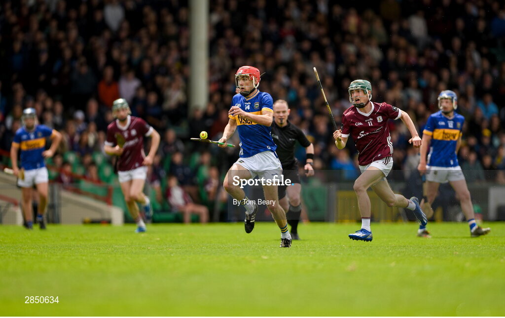 15 June 2024; Stefan Tobin of Tipperary in action against Ronan Murphy of Galway during the Electric Ireland GAA Hurling All-Ireland Minor Hurling Championship semi-final match between Tipperary and Galway at TUS Gaelic Grounds in Limerick. Photo by Tom Beary/Sportsfile