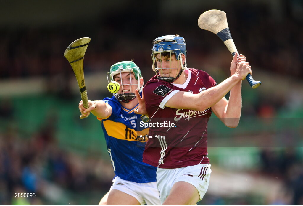 15 June 2024; Ciarán Leen of Galway in action against David Ryan of Tipperary during the Electric Ireland GAA Hurling All-Ireland Minor Hurling Championship semi-final match between Tipperary and Galway at TUS Gaelic Grounds in Limerick. Photo by Tom Beary/Sportsfile