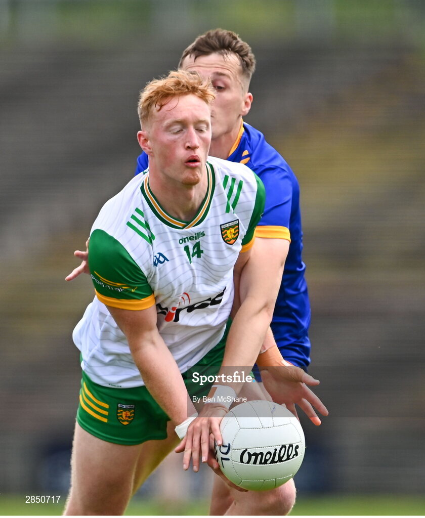 15 June 2024; Oisin Gallen of Donegal is tackled by Aaron Griffin of Clare during the GAA Football All-Ireland Senior Championship Round 3 match between Clare and Donegal at Hastings Insurance MacHale Park in Castlebar, Mayo. Photo by Ben McShane/Sportsfile