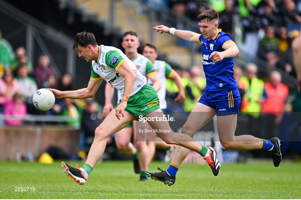 15 June 2024; Michael Langan of Donegal in action against Brian McNamara of Clare during the GAA Football All-Ireland Senior Championship Round 3 match between Clare and Donegal at Hastings Insurance MacHale Park in Castlebar, Mayo. Photo by Ben McShane/Sportsfile