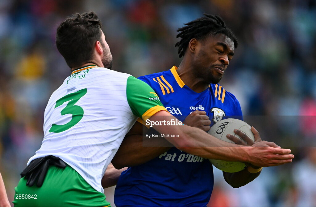 15 June 2024; Ikem Ugweru of Clare in action against Brendan McCole of Donegal during the GAA Football All-Ireland Senior Championship Round 3 match between Clare and Donegal at Hastings Insurance MacHale Park in Castlebar, Mayo. Photo by Ben McShane/Sportsfile