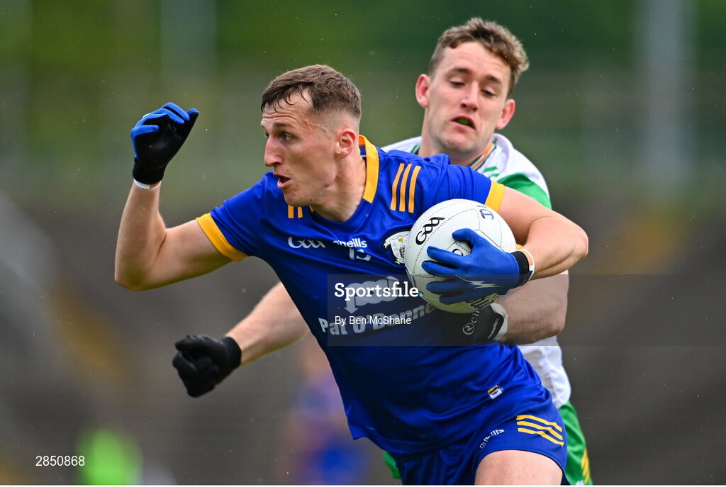 15 June 2024; Emmet McMahon of Clare is tackled by Hugh McFadden of Donegal during the GAA Football All-Ireland Senior Championship Round 3 match between Clare and Donegal at Hastings Insurance MacHale Park in Castlebar, Mayo. Photo by Ben McShane/Sportsfile