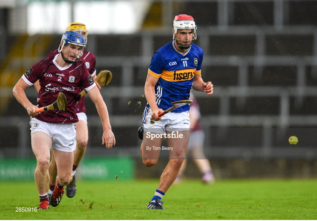 15 June 2024; Euan Murray of Tipperary in action against Cathal Maloney of Galway during the Electric Ireland GAA Hurling All-Ireland Minor Hurling Championship semi-final match between Tipperary and Galway at TUS Gaelic Grounds in Limerick. Photo by Tom Beary/Sportsfile