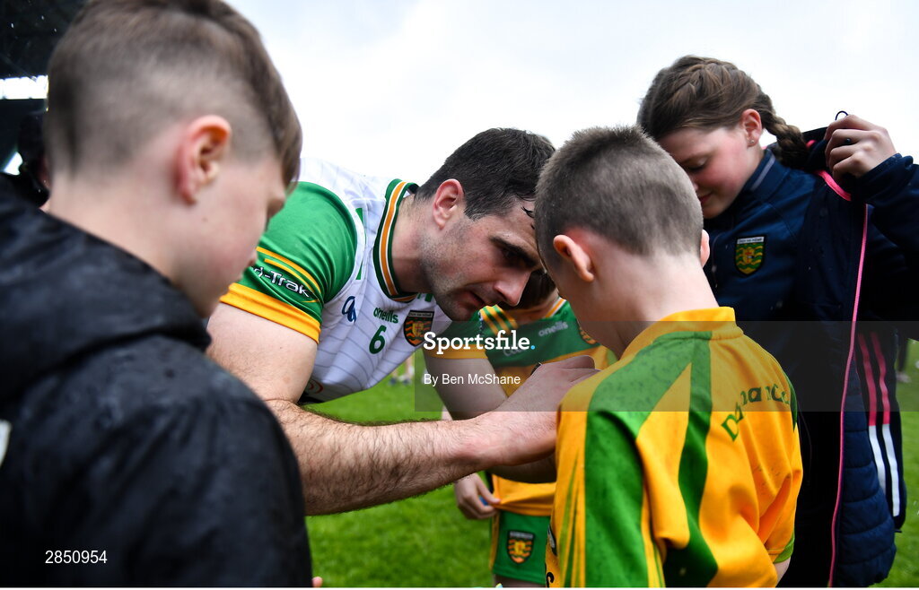 15 June 2024; Caolan McGonagle of Donegal signs autographs for supporters after the GAA Football All-Ireland Senior Championship Round 3 match between Clare and Donegal at Hastings Insurance MacHale Park in Castlebar, Mayo. Photo by Ben McShane/Sportsfile