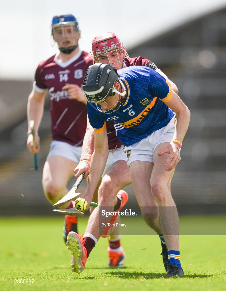 15 June 2024; Owen O'Dwyer of Tipperary is tackled by Harry Holmes of Galway during the Electric Ireland GAA Hurling All-Ireland Minor Hurling Championship semi-final match between Tipperary and Galway at TUS Gaelic Grounds in Limerick. Photo by Tom Beary/Sportsfile