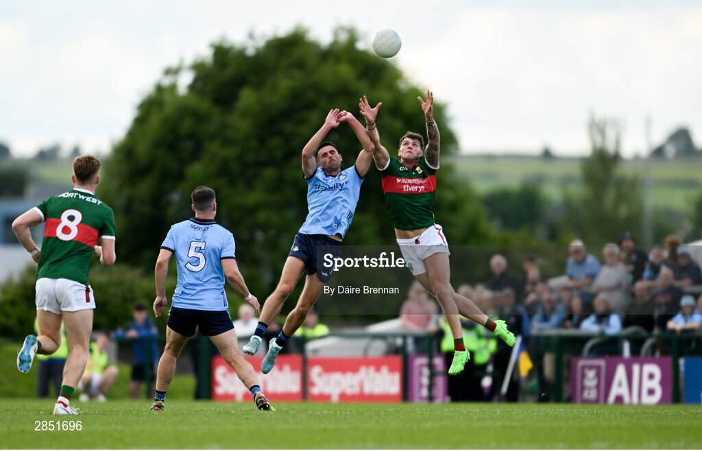 16 June 2024; Jordan Flynn of Mayo in action against Niall Scully of Dublin during the GAA Football All-Ireland Senior Championship Round 3 match between Dublin and Mayo at Dr Hyde Park in Roscommon. Photo by Daire Brennan/Sportsfile