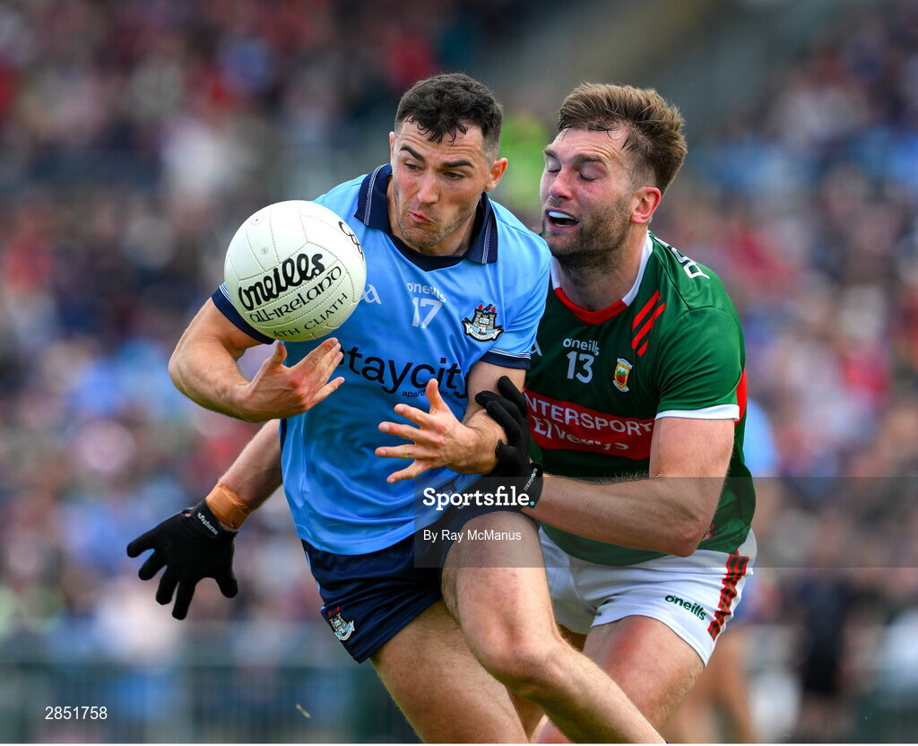 16 June 2024; Colm Basquel of Dublin is tackled by Aidan O'Shea of Mayo during the GAA Football All-Ireland Senior Championship Round 3 match between Dublin and Mayo at Dr Hyde Park in Roscommon. Photo by Ray McManus/Sportsfile