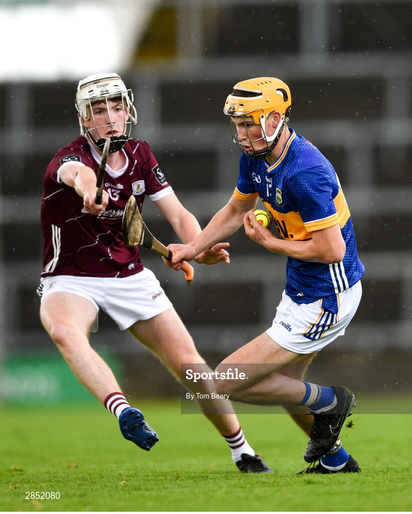 15 June 2024; Eoghan Doughan of Tipperary in action against Jamie Ryan of Galway during the Electric Ireland GAA Hurling All-Ireland Minor Hurling Championship semi-final match between Tipperary and Galway at TUS Gaelic Grounds in Limerick. Photo by Tom Beary/Sportsfile