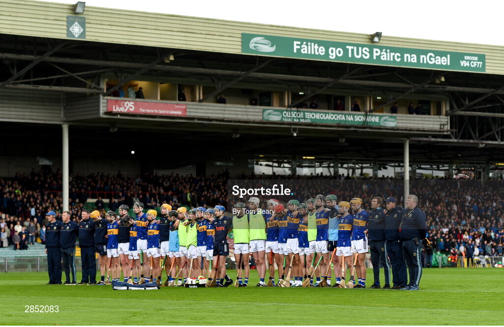 15 June 2024; Tipperary players and management team stand for the playing of the Amhrán na bhFiann before the Electric Ireland GAA Hurling All-Ireland Minor Hurling Championship semi-final match between Tipperary and Galway at TUS Gaelic Grounds in Limerick. Photo by Tom Beary/Sportsfile