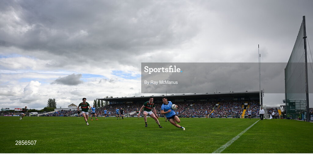 16 June 2024; Colm Basquel of Dublin is tackled by Stephen Coen of Mayo during the GAA Football All-Ireland Senior Championship Round 3 match between Dublin and Mayo at Dr Hyde Park in Roscommon. Photo by Ray McManus/Sportsfile