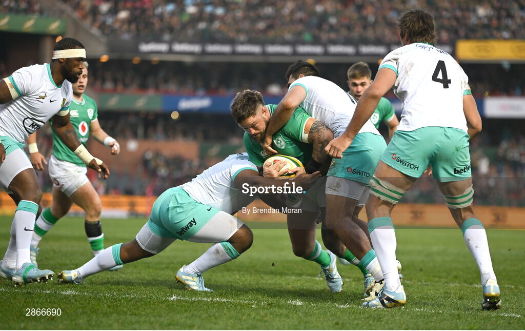 6 July 2024; Andrew Porter of Ireland is tackled by Frans Malherbe and Damian de Allende of South Africa during the first test between South Africa and Ireland at Loftus Versfeld Stadium in Pretoria, South Africa. Photo by Brendan Moran/Sportsfile