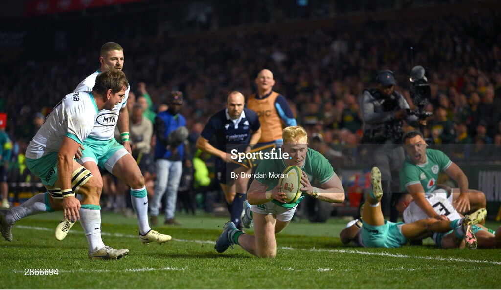 6 July 2024; Jamie Osborne of Ireland scores his side's first try despite the tackle of Kwagga Smith of South Africa during the first test between South Africa and Ireland at Loftus Versfeld Stadium in Pretoria, South Africa. Photo by Brendan Moran/Sportsfile