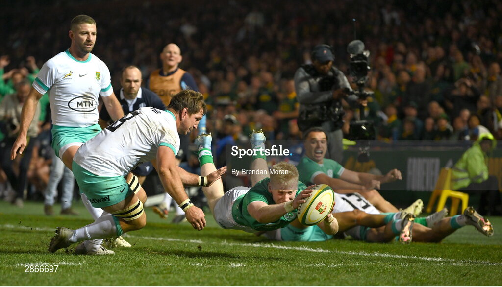 6 July 2024; Jamie Osborne of Ireland scores his side's first try despite the tackle of Kwagga Smith of South Africa during the first test between South Africa and Ireland at Loftus Versfeld Stadium in Pretoria, South Africa. Photo by Brendan Moran/Sportsfile
