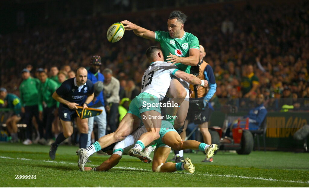 6 July 2024; James Lowe of Ireland offloads in the tackle by Jesse Kriel and Cheslin Kolbe of South Africa, in the lead up to Ireland's first try, during the first test between South Africa and Ireland at Loftus Versfeld Stadium in Pretoria, South Africa. Photo by Brendan Moran/Sportsfile