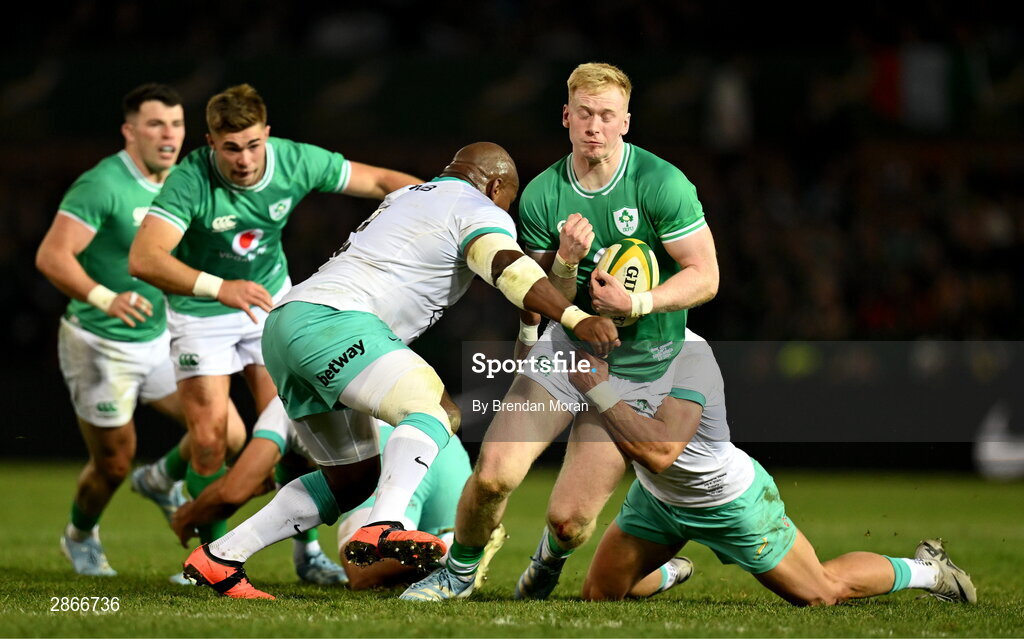 6 July 2024; Jamie Osborne of Ireland is tackled by Bongi Mbonambi of South Africa and Damian de Allende of South Africa during the first test between South Africa and Ireland at Loftus Versfeld Stadium in Pretoria, South Africa. Photo by Brendan Moran/Sportsfile