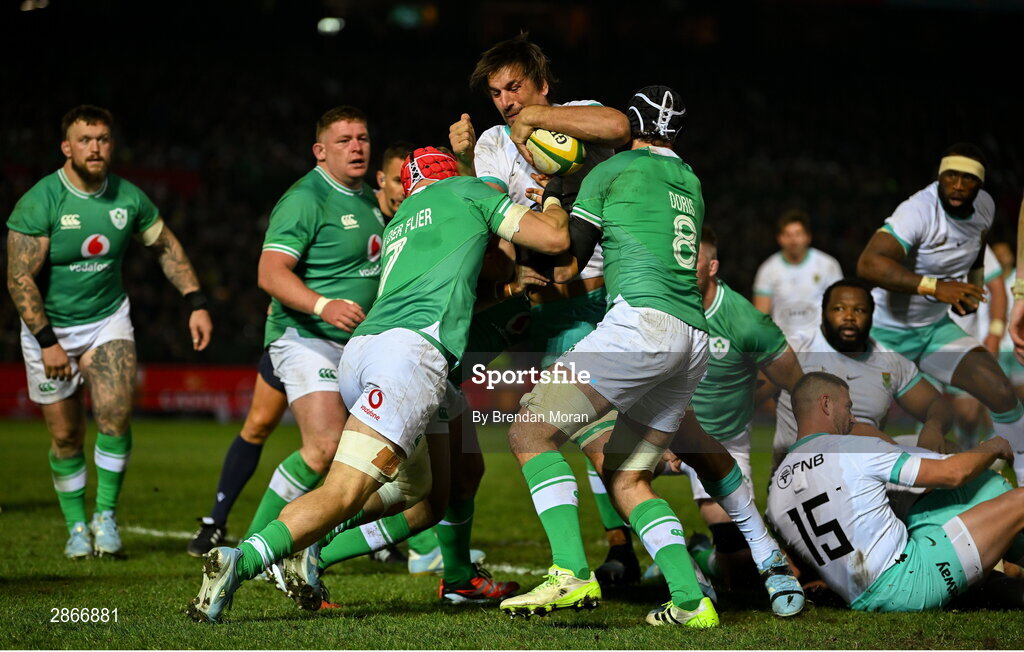 6 July 2024; Eben Etzebeth of South Africa is tackled by Josh van der Flier, left, and Caelan Doris of Ireland during the first test between South Africa and Ireland at Loftus Versfeld Stadium in Pretoria, South Africa. Photo by Brendan Moran/Sportsfile