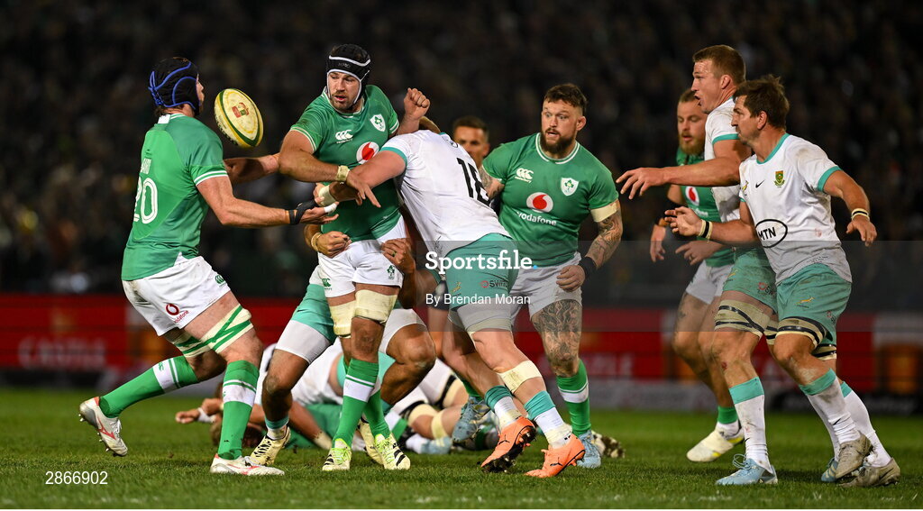 6 July 2024; Caelan Doris of Ireland passes to teammate Ryan Baird as he is tackled by Vincent Koch of South Africa during the first test between South Africa and Ireland at Loftus Versfeld Stadium in Pretoria, South Africa. Photo by Brendan Moran/Sportsfile