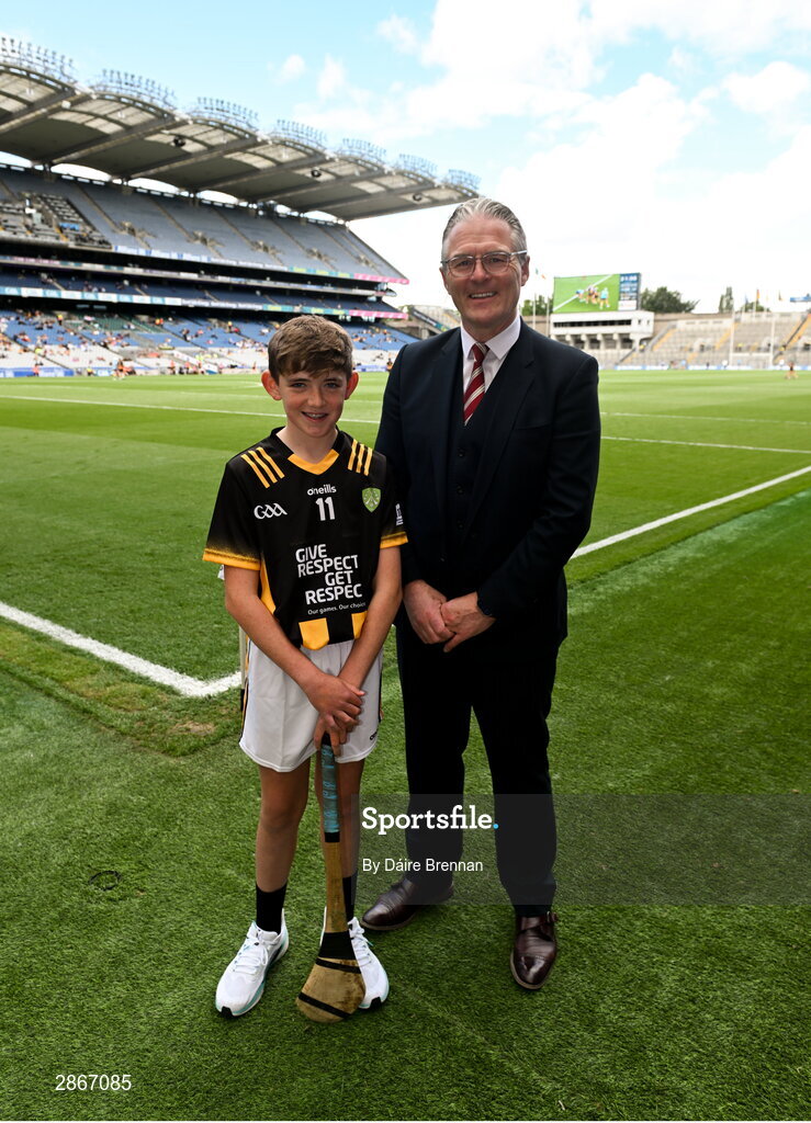 6 July 2024; Uachtarán Chumann Lúthchleas Gael Jarlath Burns with Harry Brennan, St Aidan's NS, Kilmanagh, Kilkenny, ahead of the GAA INTO Cumann na mBunscol Respect Exhibition Go Games at the GAA Hurling All-Ireland Senior Championship semi-final match between Kilkenny and Clare at Croke Park in Dublin. Photo by Daire Brennan/Sportsfile