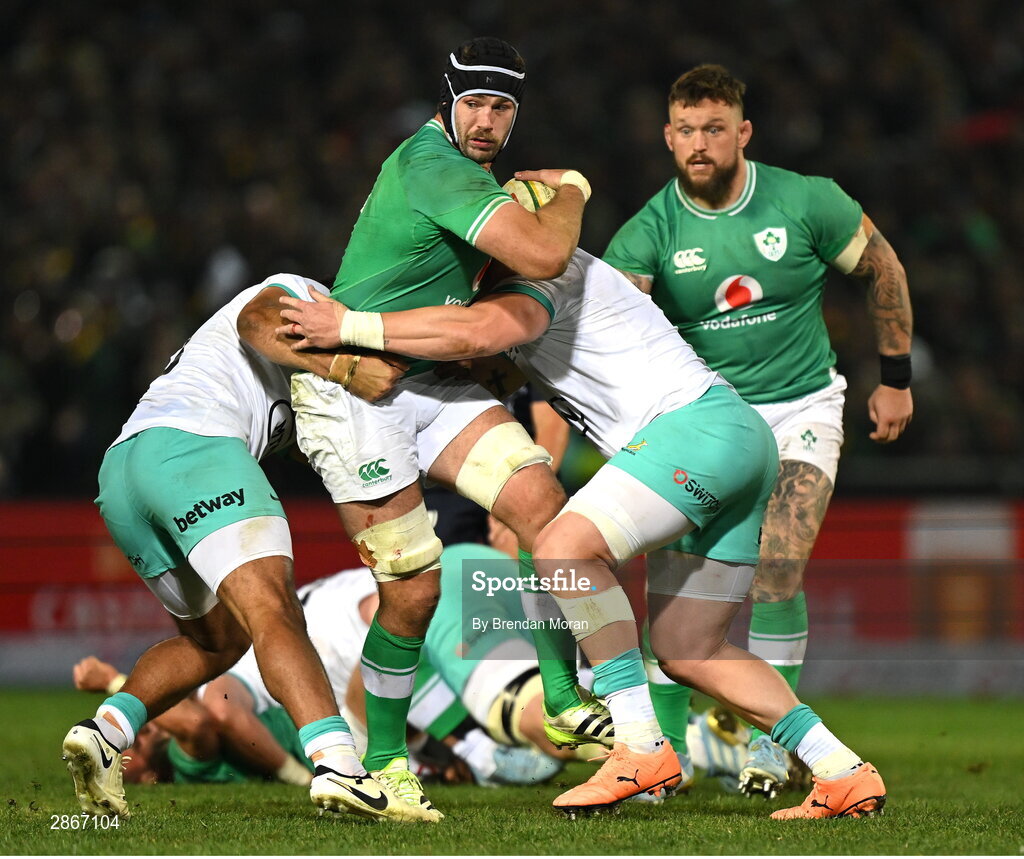 6 July 2024; Caelan Doris of Ireland is tackled by Damian de Allende and Vincent Koch of South Africa during the first test between South Africa and Ireland at Loftus Versfeld Stadium in Pretoria, South Africa. Photo by Brendan Moran/Sportsfile