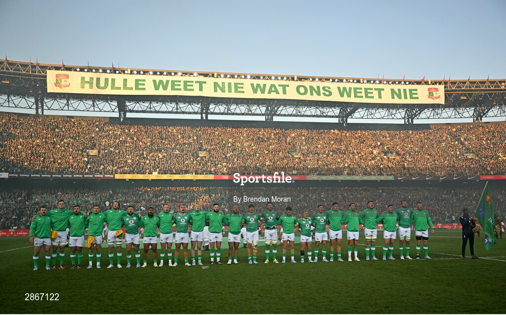 6 July 2024; The Ireland team stand for the national anthems, as a sign on at the top of the stands reads 'they don;t know what we know', before the first test between South Africa and Ireland at Loftus Versfeld Stadium in Pretoria, South Africa. Photo by Brendan Moran/Sportsfile