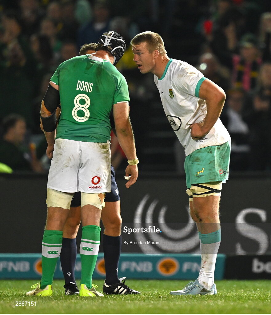 6 July 2024; Captains Caelan Doris of Ireland and Pieter-Steph du Toit of South Africa listen to referee Luke Pearce during the first test between South Africa and Ireland at Loftus Versfeld Stadium in Pretoria, South Africa. Photo by Brendan Moran/Sportsfile