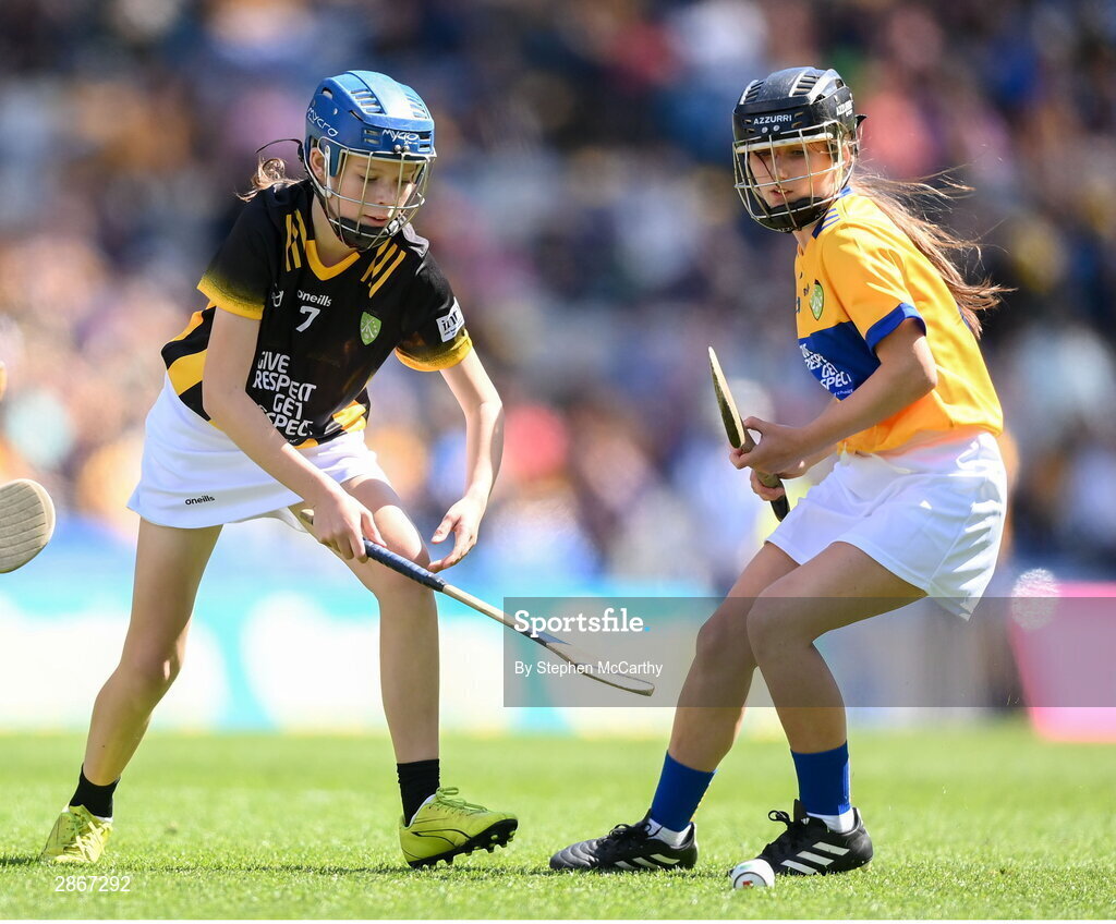 6 July 2024; Eva Hamilton, Bunscoil Bóthar na Naomh, Port Láirge, representing Kilkenny, and Kayla Reynolds, St Manachan's NS, Mohill, Leitrim, representing Clare, during the GAA INTO Cumann na mBunscol Respect Exhibition Go Games at the GAA Hurling All-Ireland Senior Championship semi-final match between Kilkenny and Clare at Croke Park in Dublin. Photo by Stephen McCarthy/Sportsfile